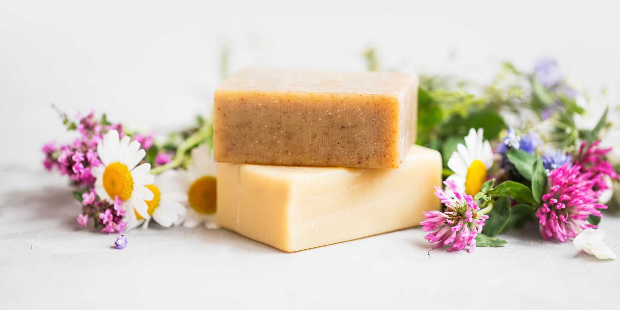 bars of soap with dandelions and flowers